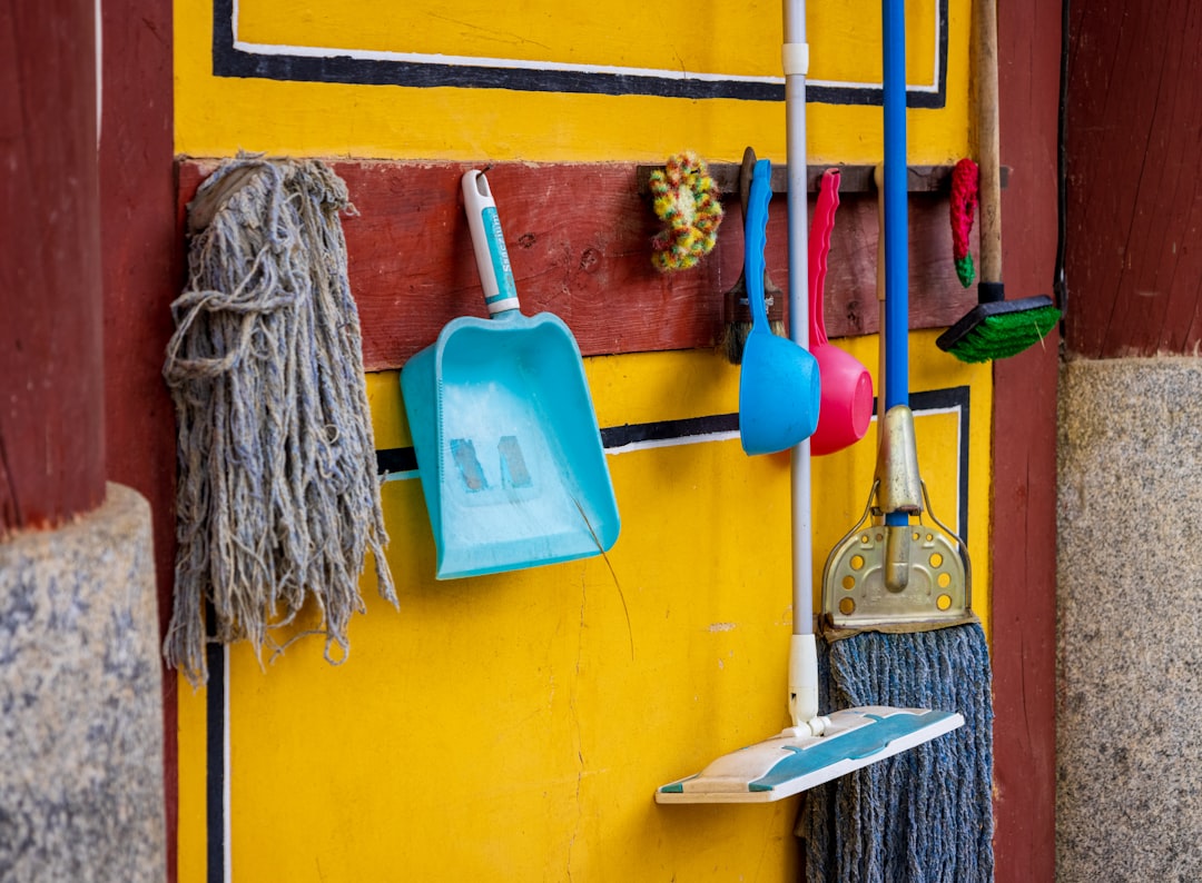 creative a-yellow-wall-with-a-blue-and-white-towel-from-it-bvrjbcmn0eu